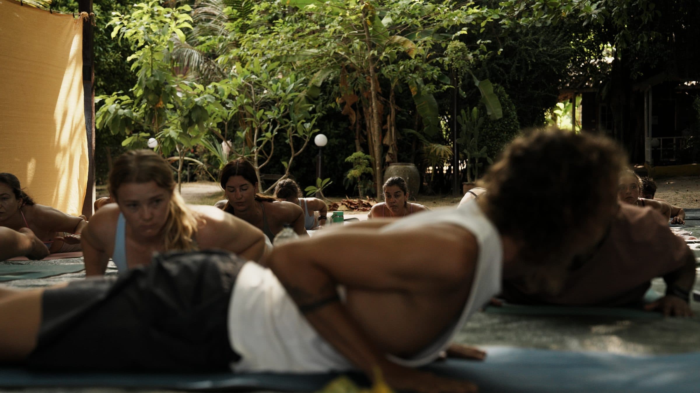 Markus leading a warm outdoor yoga class in the jungle on Koh Phangan